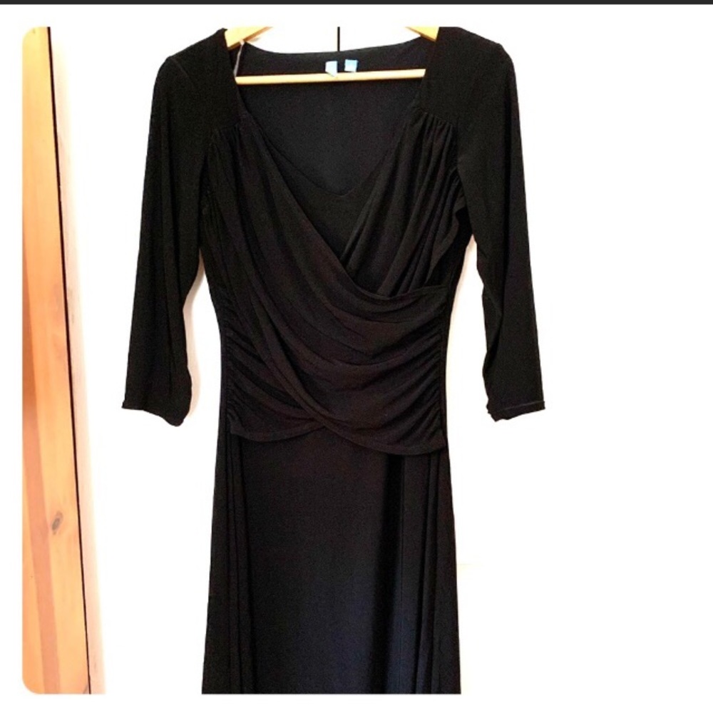 Black dress w/slimming built into the waist, wrap look on top, bottom flairs out